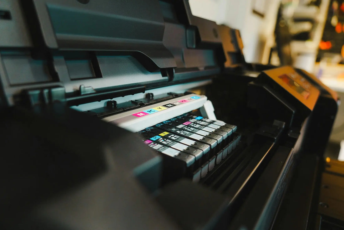 Close up of black color printer showing ink cartridges inside